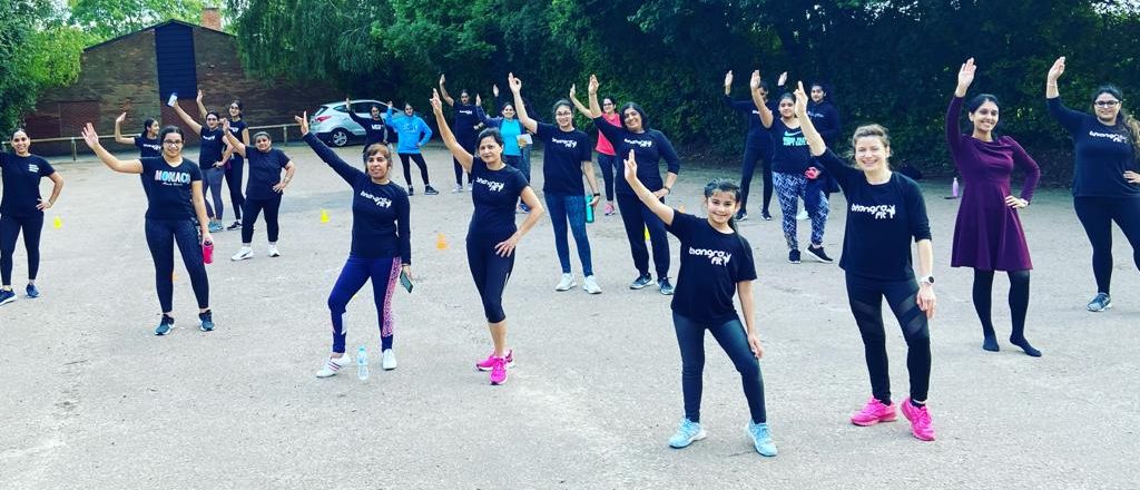 Group of social distanced women participating in Bhangra Fit sessions