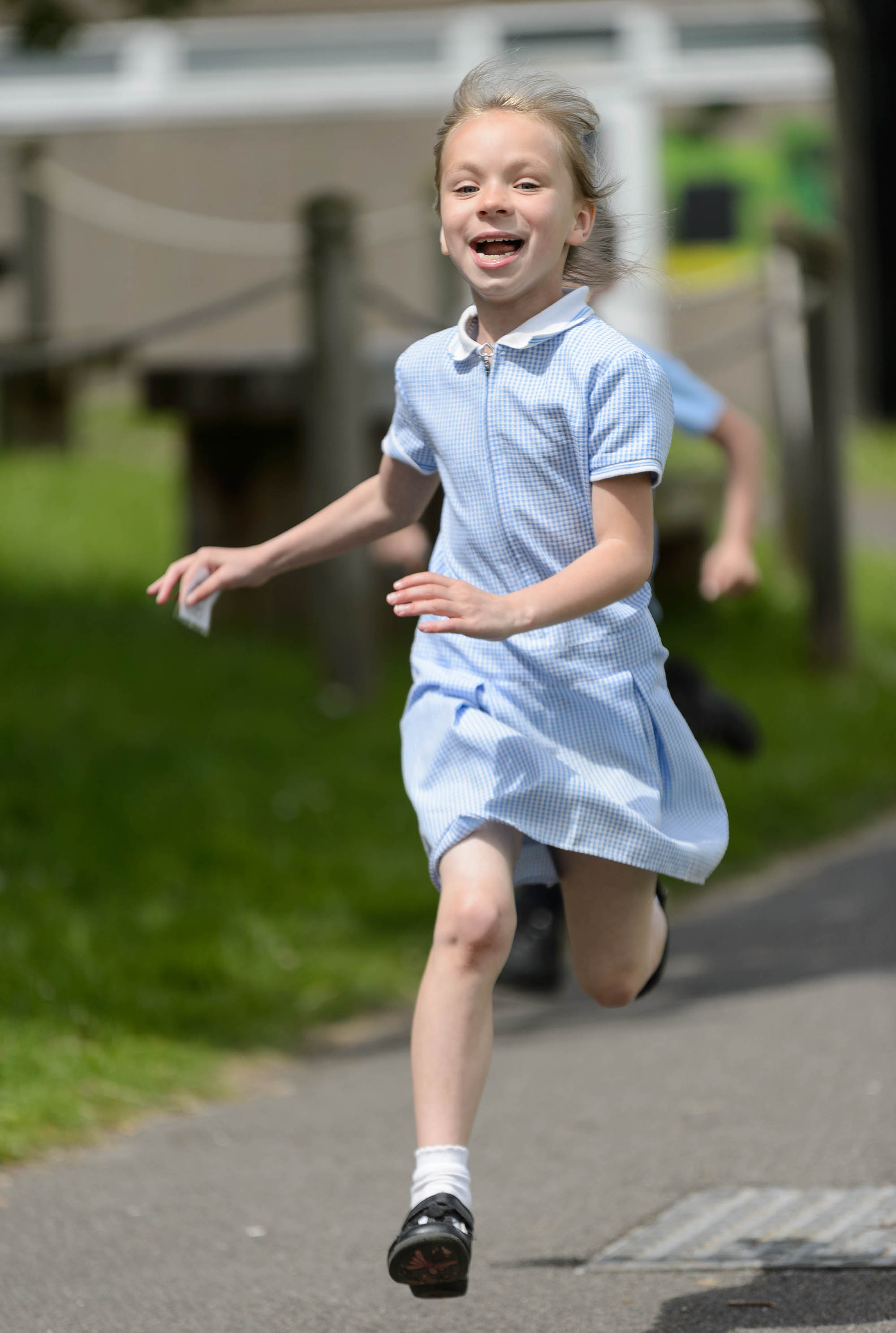 girl running in school uniform 