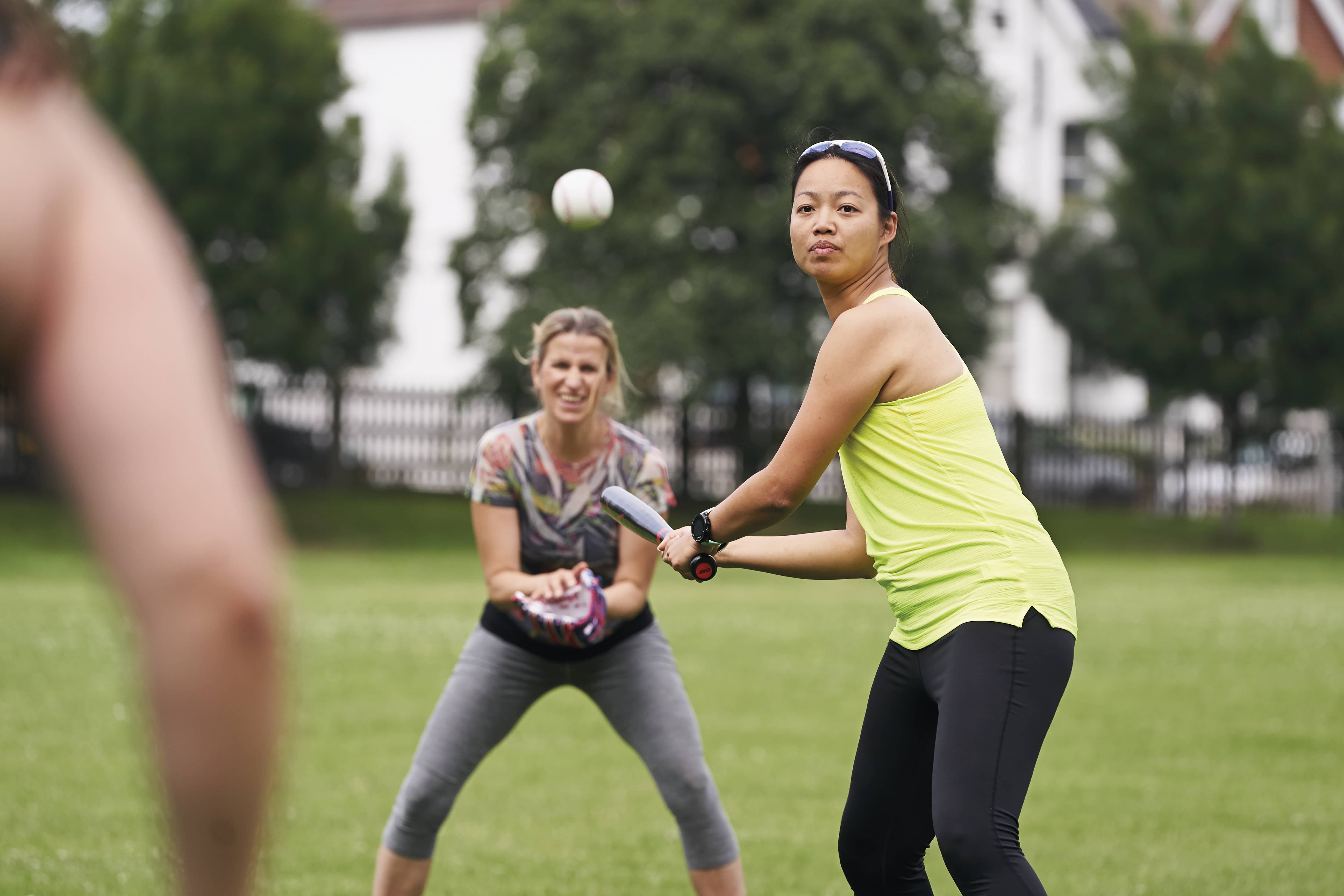 women playing rounders in the park