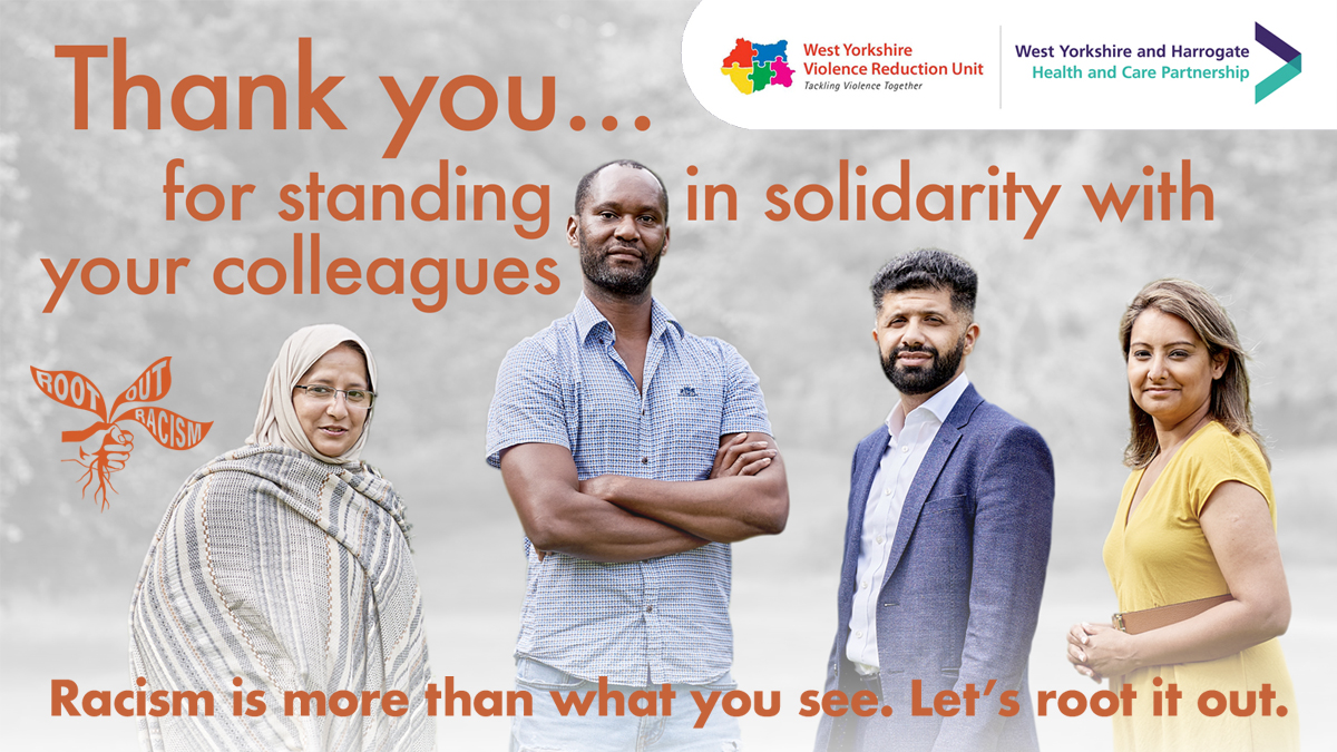 a black man, an asian man, and two asian women, one wearing a headscarf, standing in front of a poster saying thank you for standing in solitary with your colleagues. 