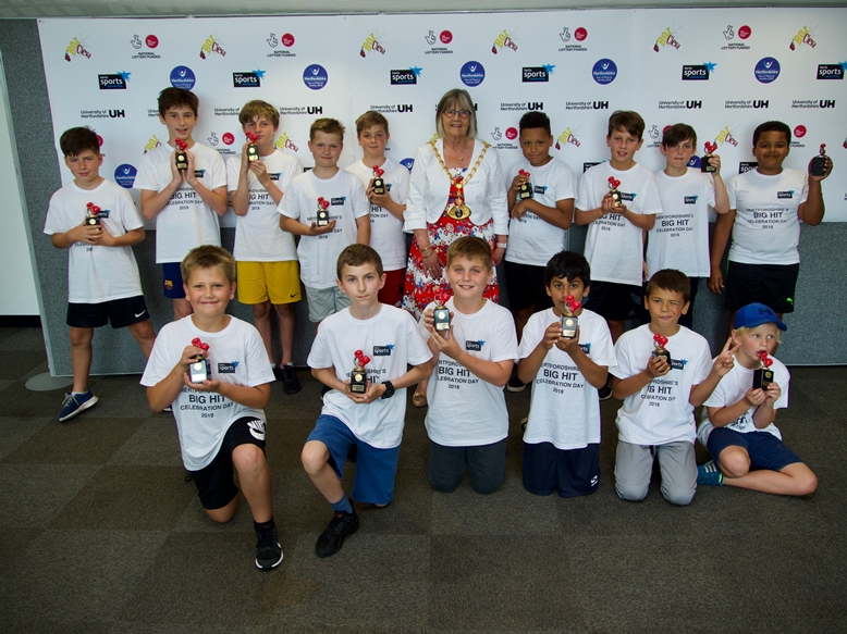Young participants with their celebration trophies 