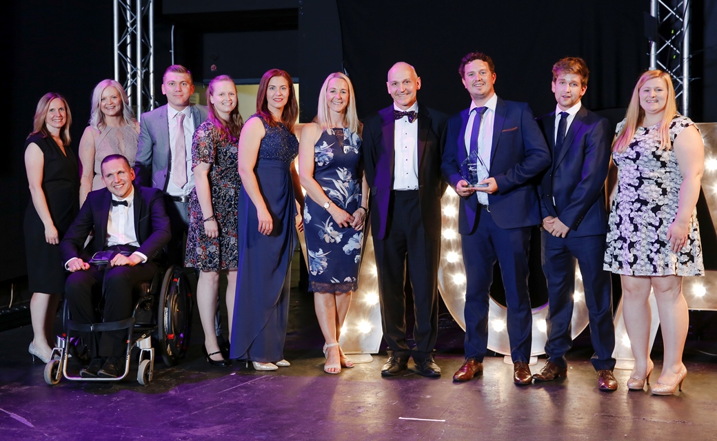 Herts Sports Partnership Team receiving award on stage 