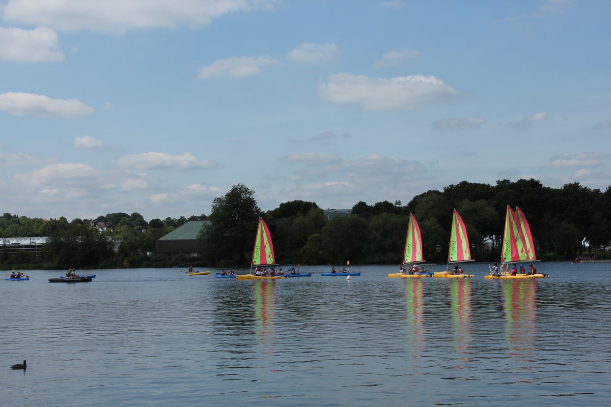 Boats sailing on lake