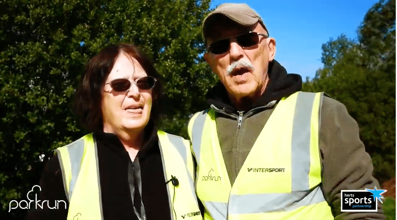 Two people enjoying volunteering at Park Run