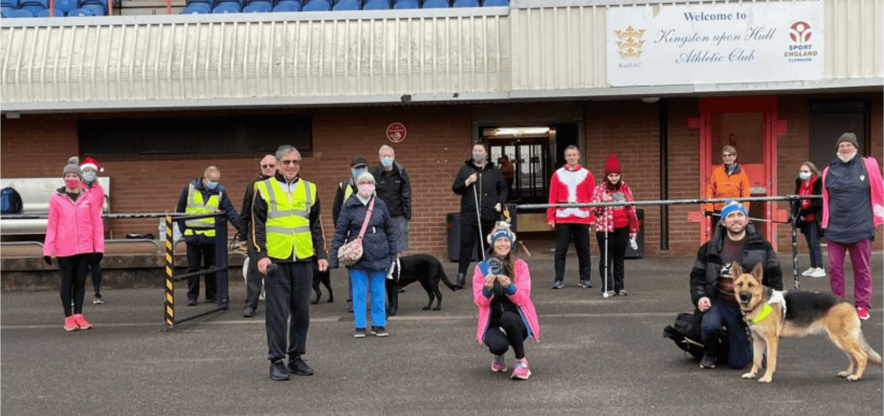 group picture of people with their guide dogs and walking canes
