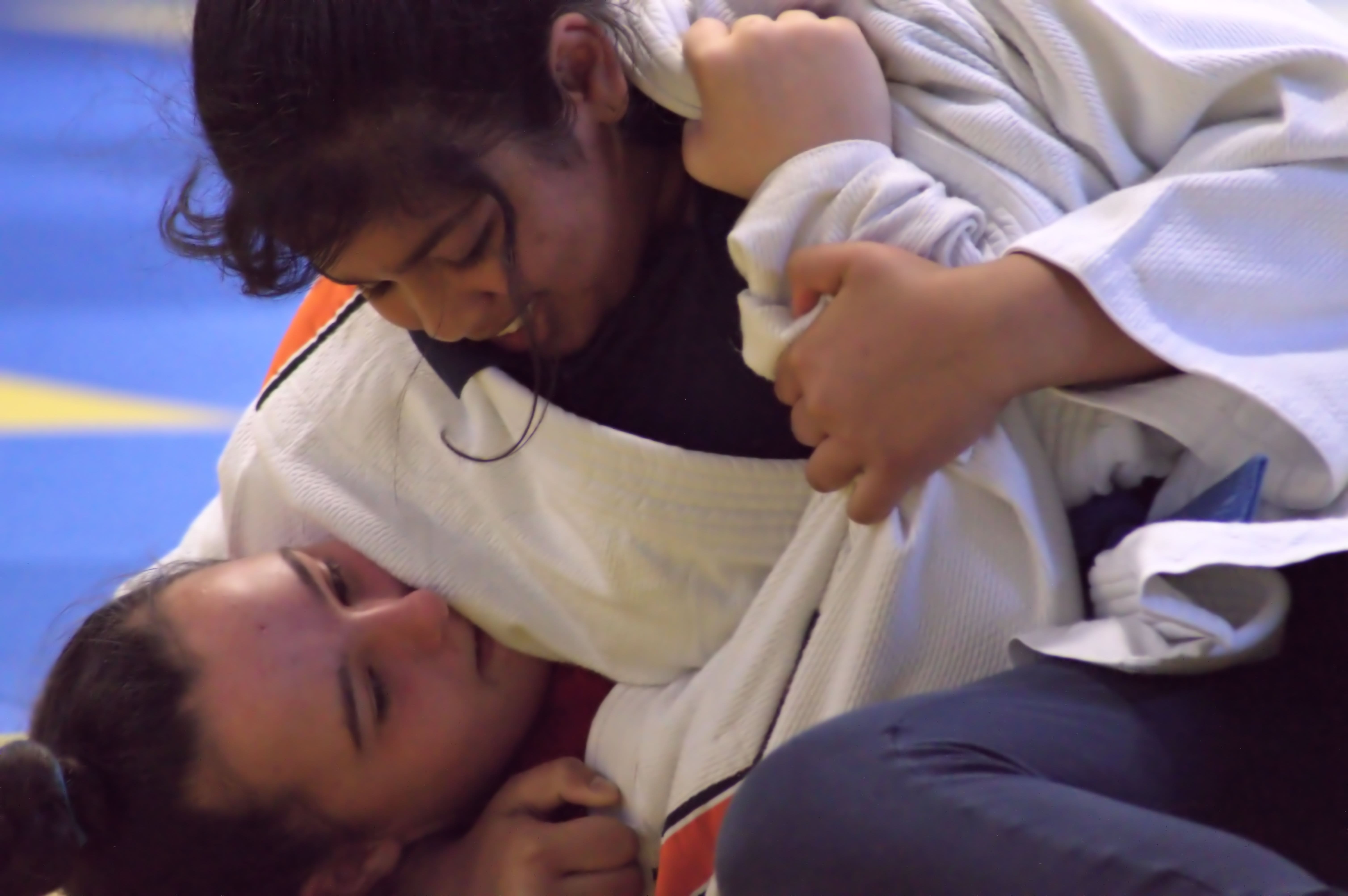 two girls competing in a judo match