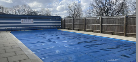 outdoor pool with a cover on