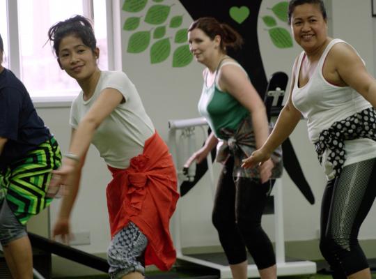 women having fun in an exercise class