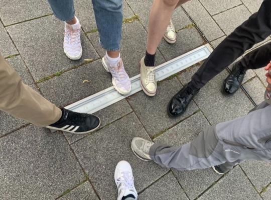 group of females feet with trainers on